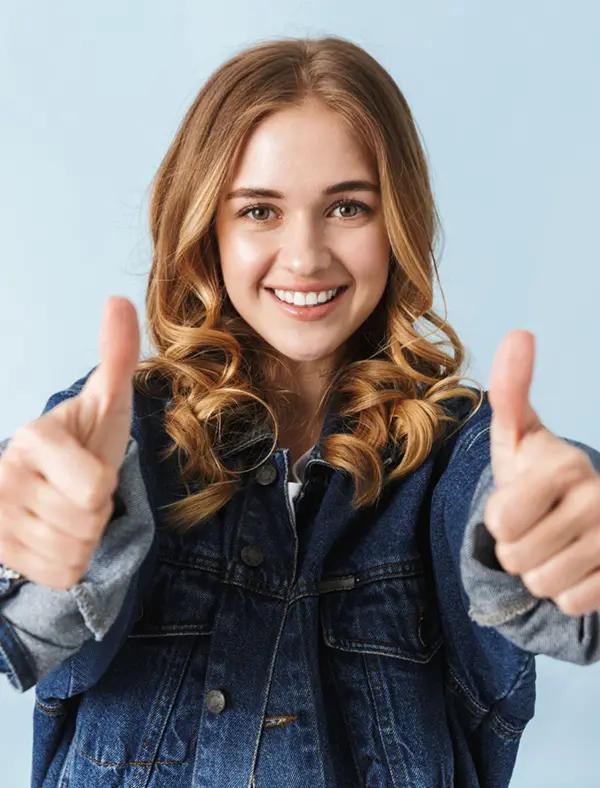 Attractive young girl standing isolated over white